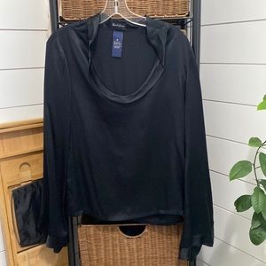 Black silk blouse with open cuffs and draping neckline